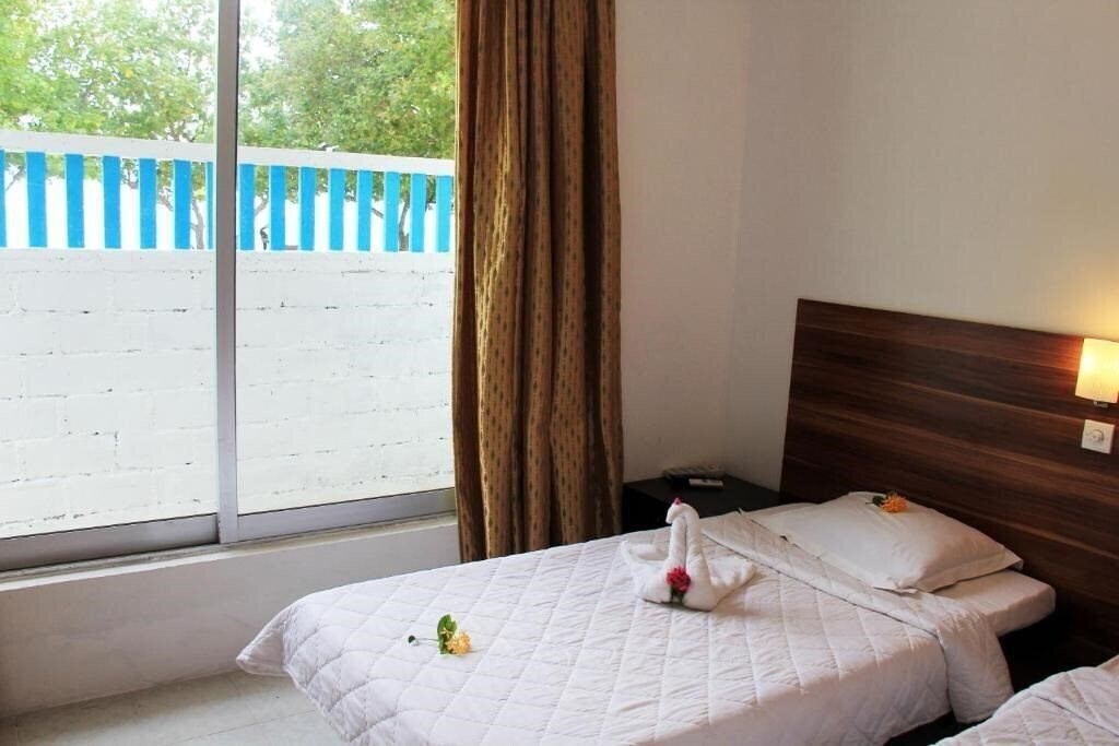 Фото Rip Tide Vacation Inn Guest House гостиный двор